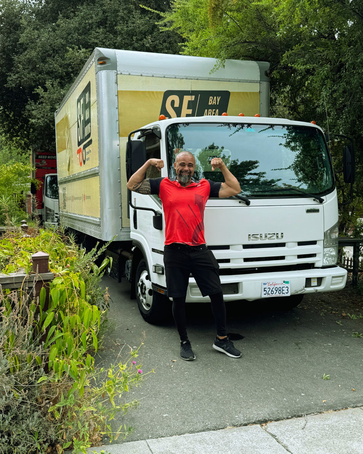 Professional moving specialist standing in front of an SF Bay Area Moving truck