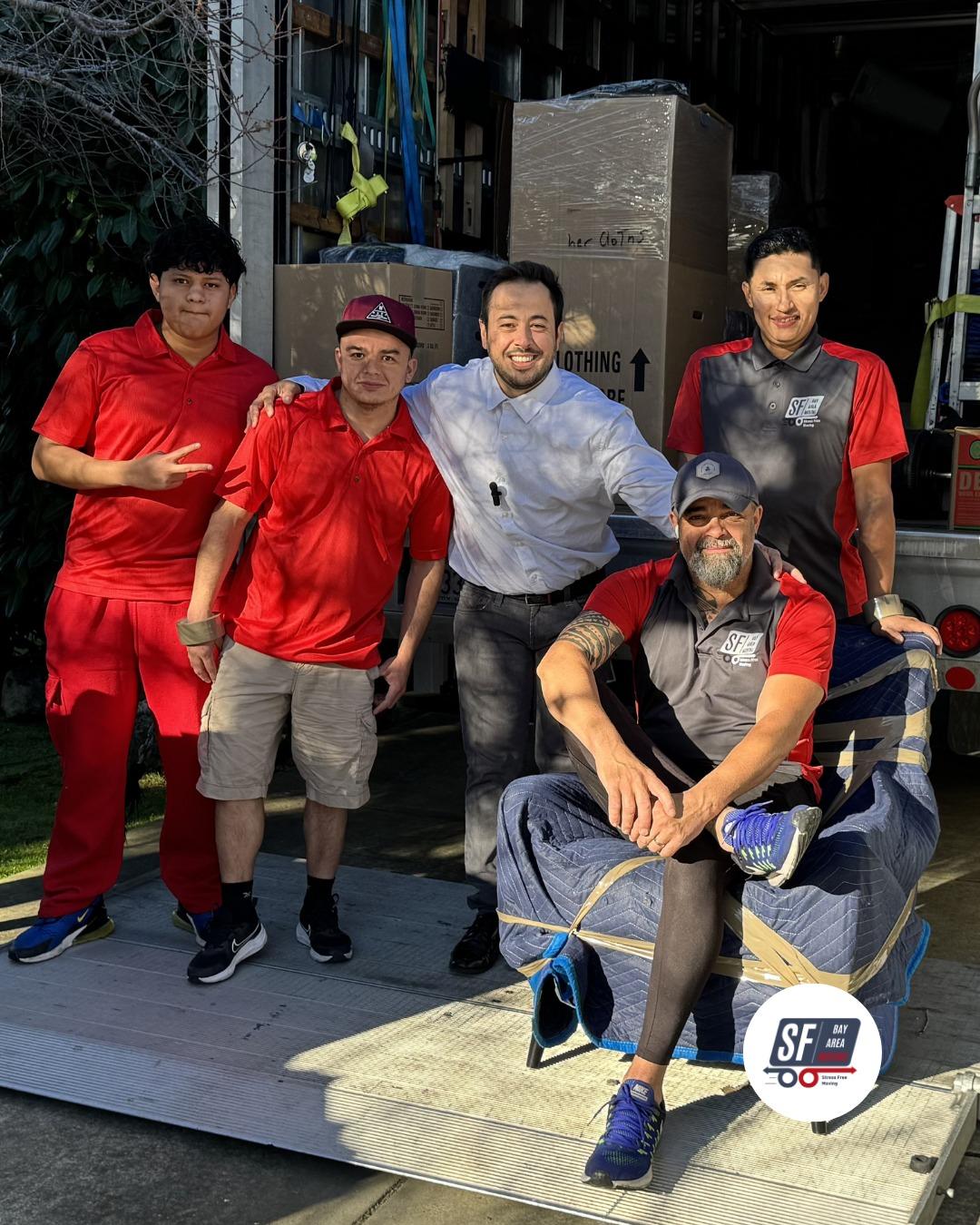 Moving team beside a hot tub in an outdoor residential area