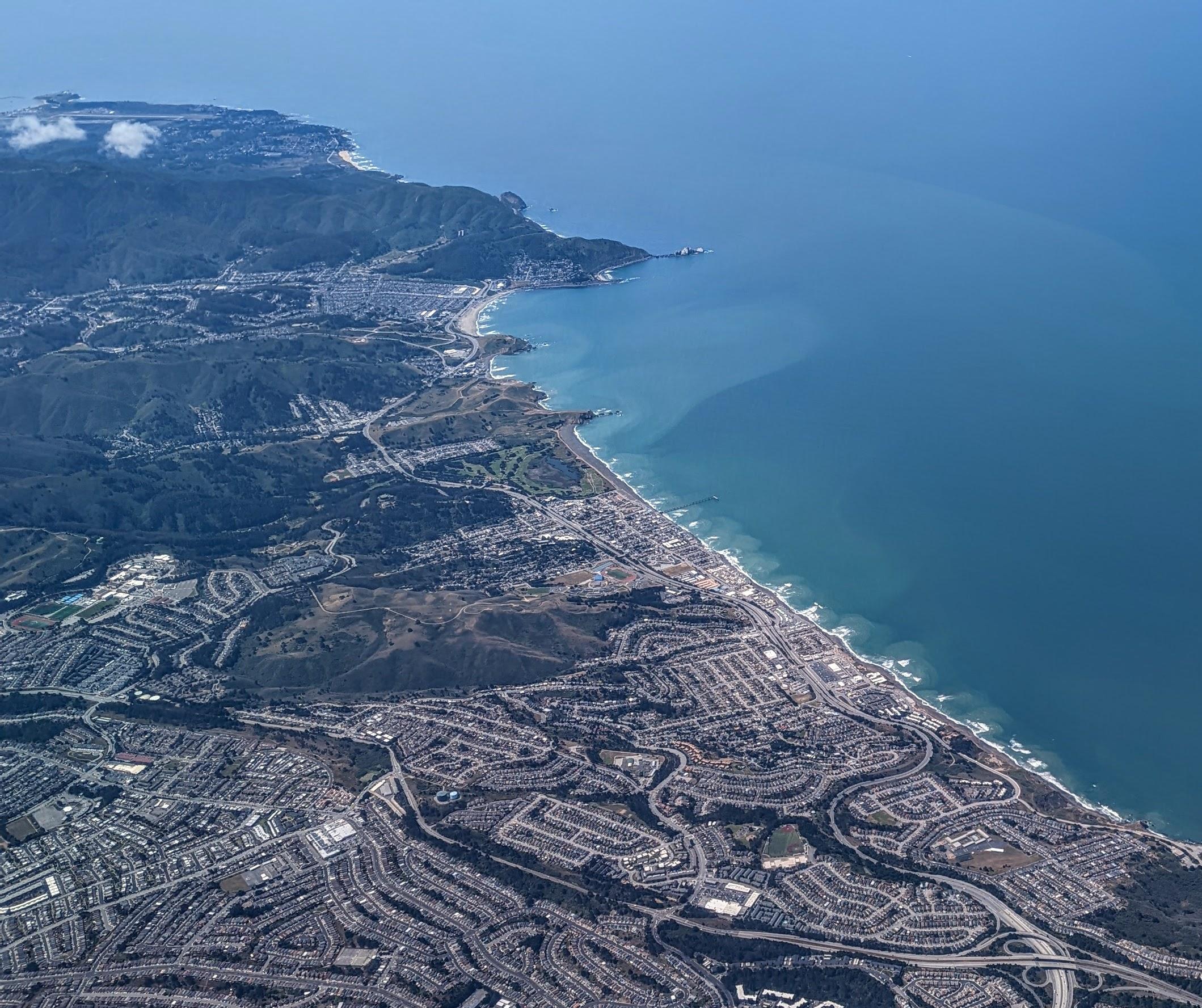 Aerial view of Pacifica California coastline and hillside neighborhoods