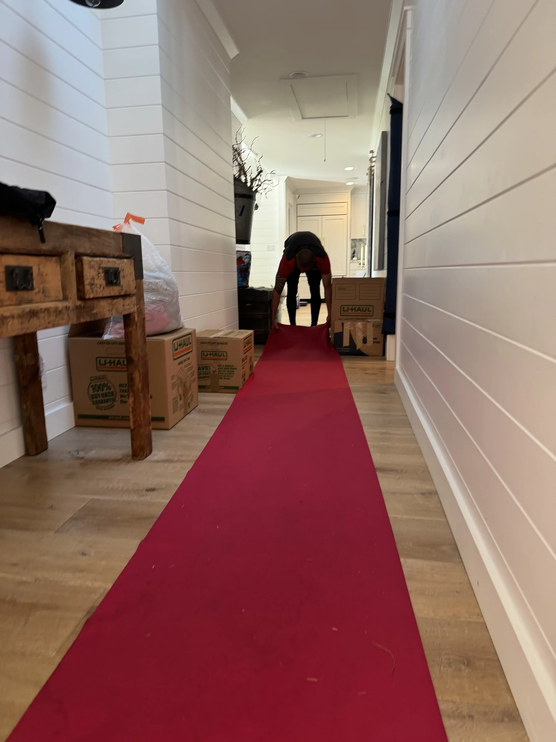 Residential hallway protected with a red floor runner during an SF Bay Area Moving job.